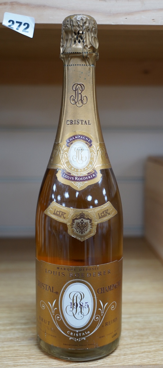 A bottle of Louis Roederer Cristal Champagne, 1985. Condition - good